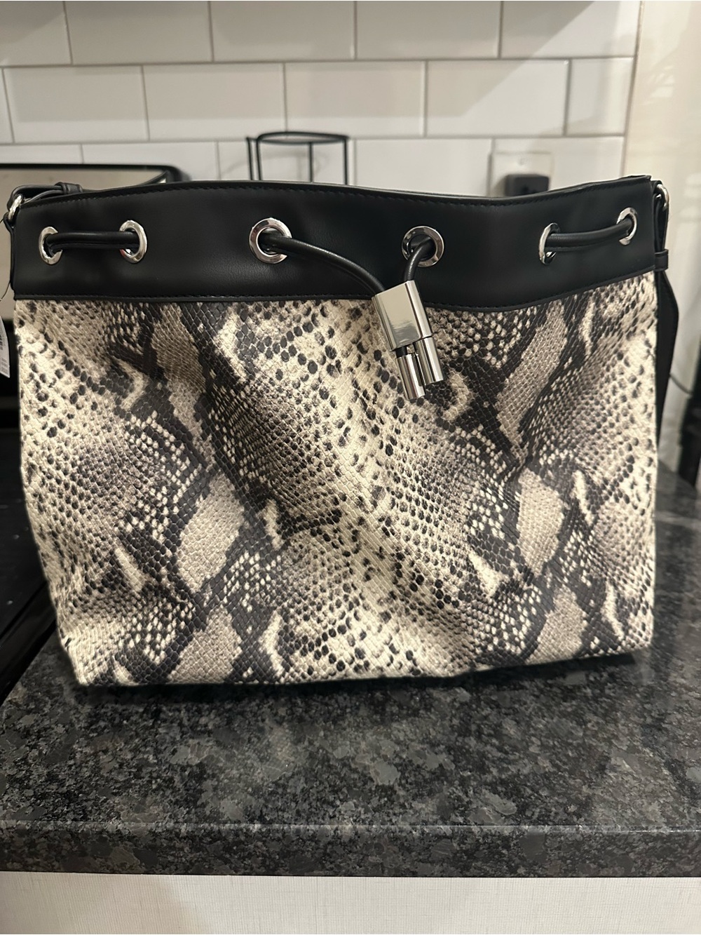 White House Black Market Snake-Print Drawstring Shoulder Bag in Black and Cream